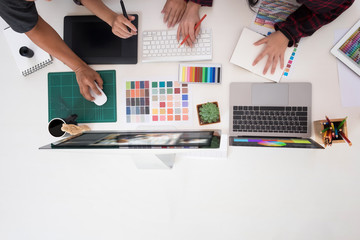 Team of graphic designers working on a computer in officeIdeas Creative Occupation Design...