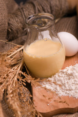Spikelets of wheat, eggs, milk, flour. Ingredients for bakery products