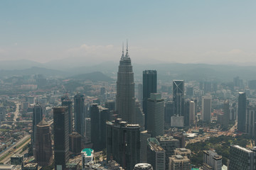 Kuala Lumpur skyline from Kuala Lumpur Tower with Petronas Twin Towers visible.