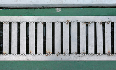 Iron grate of water drain. Top view.