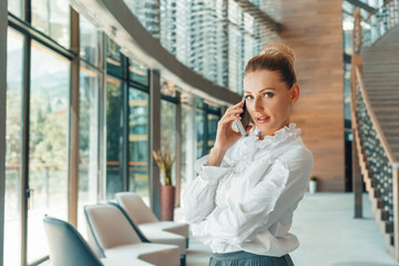 Fototapeta premium woman using mobile phone in the office