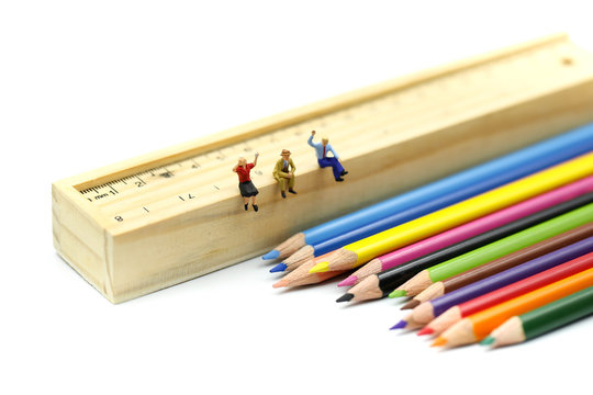 Miniature people : Businessman sitting on Color pencils,Business Education concept.