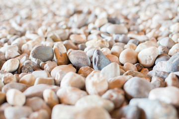 Natural pebbles form in dense brown tones.