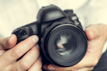 photographer with camera in hand