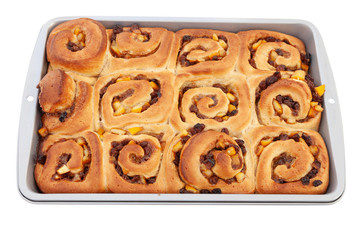 Fresh from the oven chelsea buns in a baking tin - viewed from above