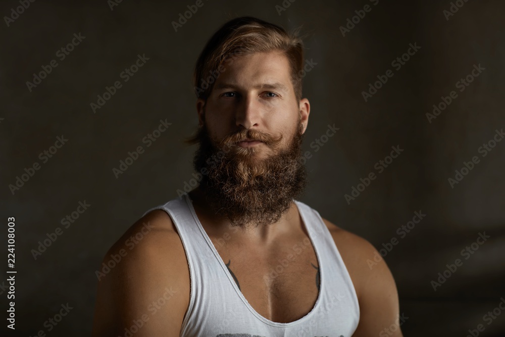 Wall mural Portrait of a young stylish bearded man