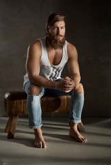 Full length portrait of young bearded man