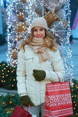Young happy woman shopping for Christmas