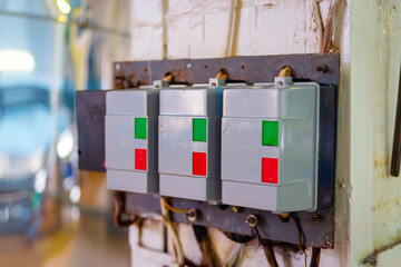 Automatic push-button switches of network equipment of three-phase network installed on the wall in the scientific and industrial laboratory
