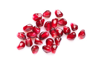 Pomegranate seeds on white