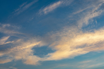 Fototapeta na wymiar sunrise sky with orange clouds and blue sky