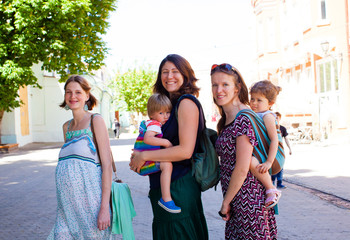 Portrait of three young mothers meeting outdoor