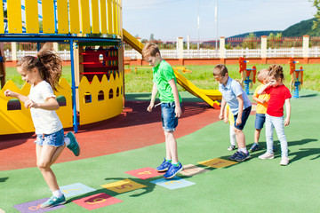 Agility and cleverness on the playground in the summer outdoors
