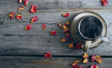 cup of coffee and rose petals