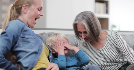 Child playing with mother and grandmother