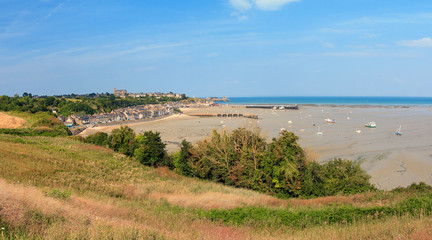 Beautiful cityscape view of the skyline and beach at low tide of the city Cancale, France, in summer