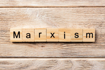 marxism word written on wood block. marxism text on table, concept