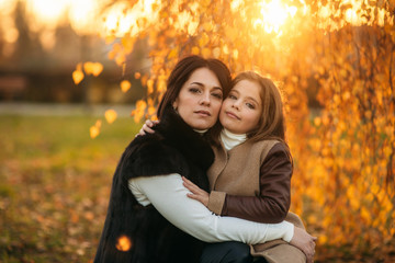 Fototapeta premium teenage girl and her mother walking in the park