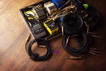Electric guitar audio processing effects on a studio floor. Electric guitar and stomp box type...