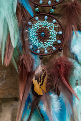 Obraz premium Handmade dream catcher with feathers threads and beads rope hanging