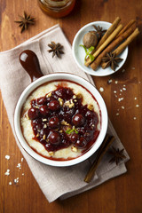Oatmeal porridge with cherry sauce and spices