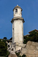 Obraz premium Tower and Statue in Genoa