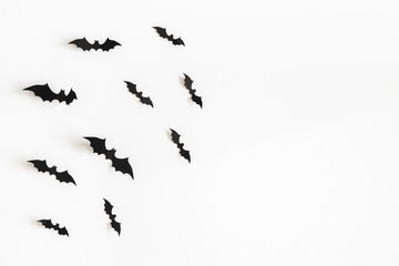 Halloween paper decorations on white background. Halloween concept. Flat lay, top view, copy space