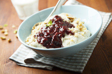 Oatmeal porridge with cherry sauce and spices