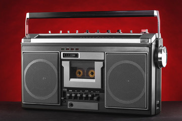 1980s Silver retro radio boom box on red background © ValentinValkov