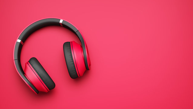 pink and black wireless headphones isolated on pink background