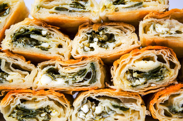 Homemade pie with cheese and spinach background