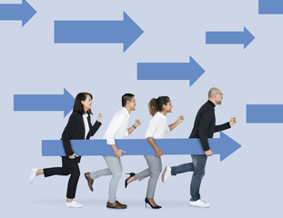 Diverse people holding blue arrows