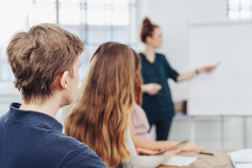 Young man in a business presentation or lecture