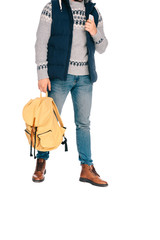 cropped shot of stylish young traveler holding backpack and smartphone isolated on white