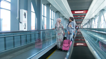 Two muslim girls on the way to the airport