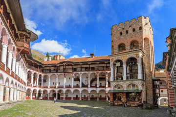 Obraz na płótnie Canvas Beautiful view of the Orthodox Rila Monastery, a famous tourist attraction and cultural heritage monument in the Rila Nature Park mountains in Bulgaria