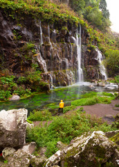 Tourist look at the waterfall.