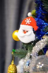 Toy santa on the christmas tree