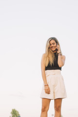 Beautiful woman using phone in outdoor