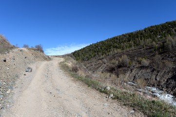  Mountain road in the area of the river Yarlyamry. Mountain Altai.Siberia. Russia