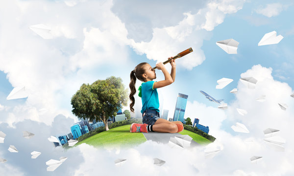 Concept of careless happy childhood with girl looking in future