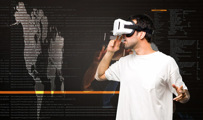 Man using VR glasses inside the virtual reality mode