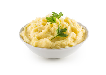 Mashed potatoes in bowl isolated on white.