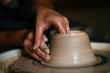 Creation of a vase and modeling of clay in a professional pottery workshop