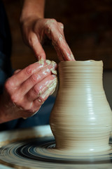 Creation of a vase and modeling of clay in a professional pottery workshop