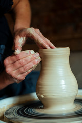 Creation of a vase and modeling of clay in a professional pottery workshop
