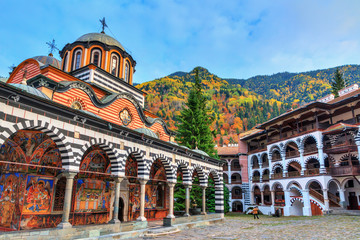 Beautiful view of the Orthodox Rila Monastery, a famous tourist attraction and cultural heritage monument in the Rila Nature Park mountains in Bulgaria - obrazy, fototapety, plakaty