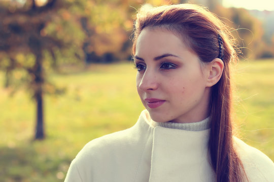 girl in a park walk autumn alone