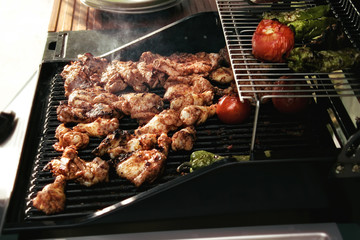 close up cooking chicken on barbecue