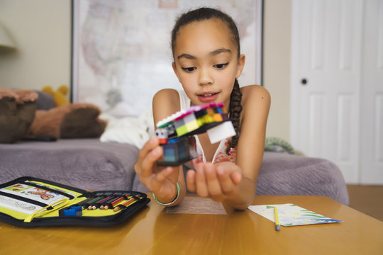 Tween Girl Playing with Building Blocks